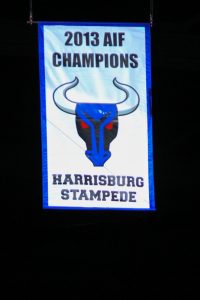 HERSHEY, PA - The Harrisburg Stampede's 2013 AIF Champions banner is lowered from Giant Center's rafters (Kyle Mace / Sweetest Hockey on Earth)