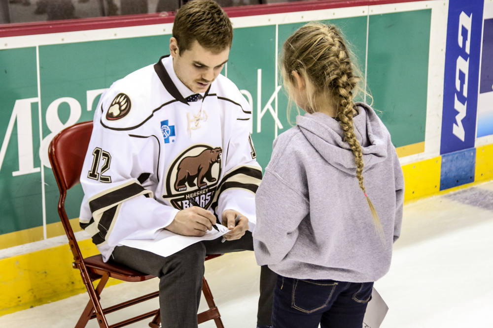 Jeremy Langlois Signs For A Young Fan.