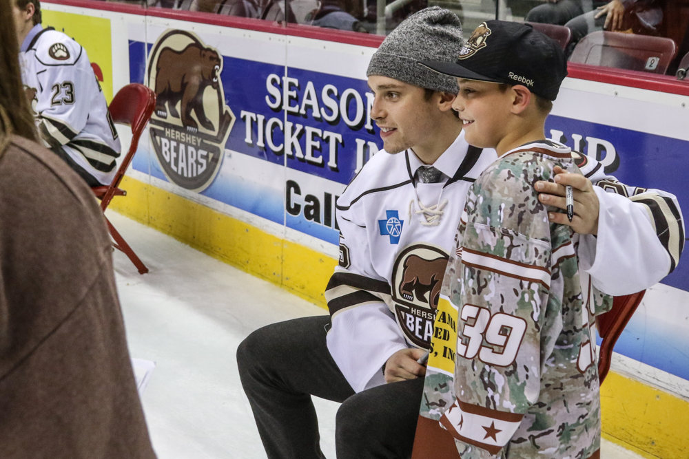 Colby Williams Poses With A Young Hockey Player