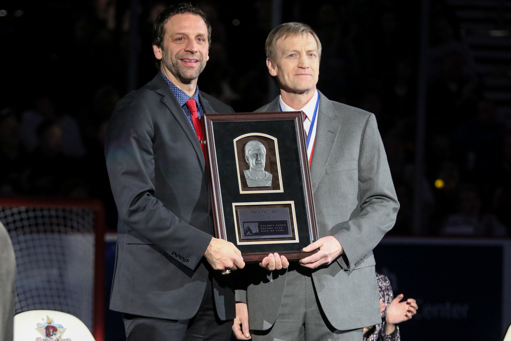 Dave Fenyves Poses With His Plaque With Bryan Helmer