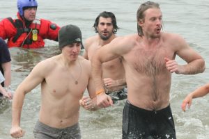 Harrisburg, PA - David Leggio (left) and John Mitchell run in after jumping into the Susquehanna River (Kyle Mace / Sweetest Hockey on Earth) 