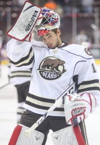 HERSHEY, PA - Michal Neuvirth adjusts his helmet during warm-ups prior to the game Saturday, December 14, 2013 (Kyle Mace / Sweetest Hockey on Earth)