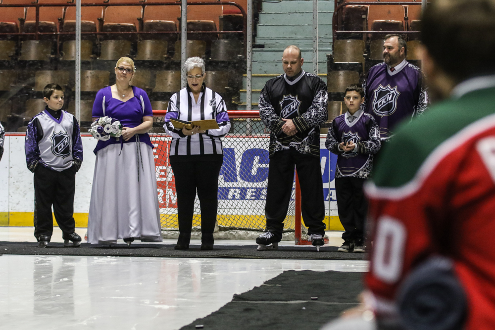 Kym Hamilton And Corry Hartmoyer Stand In Front Of The Net At The Beginning Of Their Wedding At Hersheypark Arena