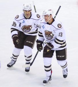 Scott Gomez and Jakub Vrana share a laugh after a goal earlier in the season (Kyle Mace / Chocolate Hockey)